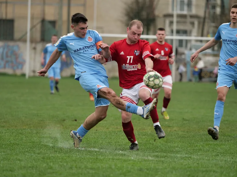 Dynamic moment capturing two soccer teams in action on the field during a competitive match. (stock photo via Pexels)